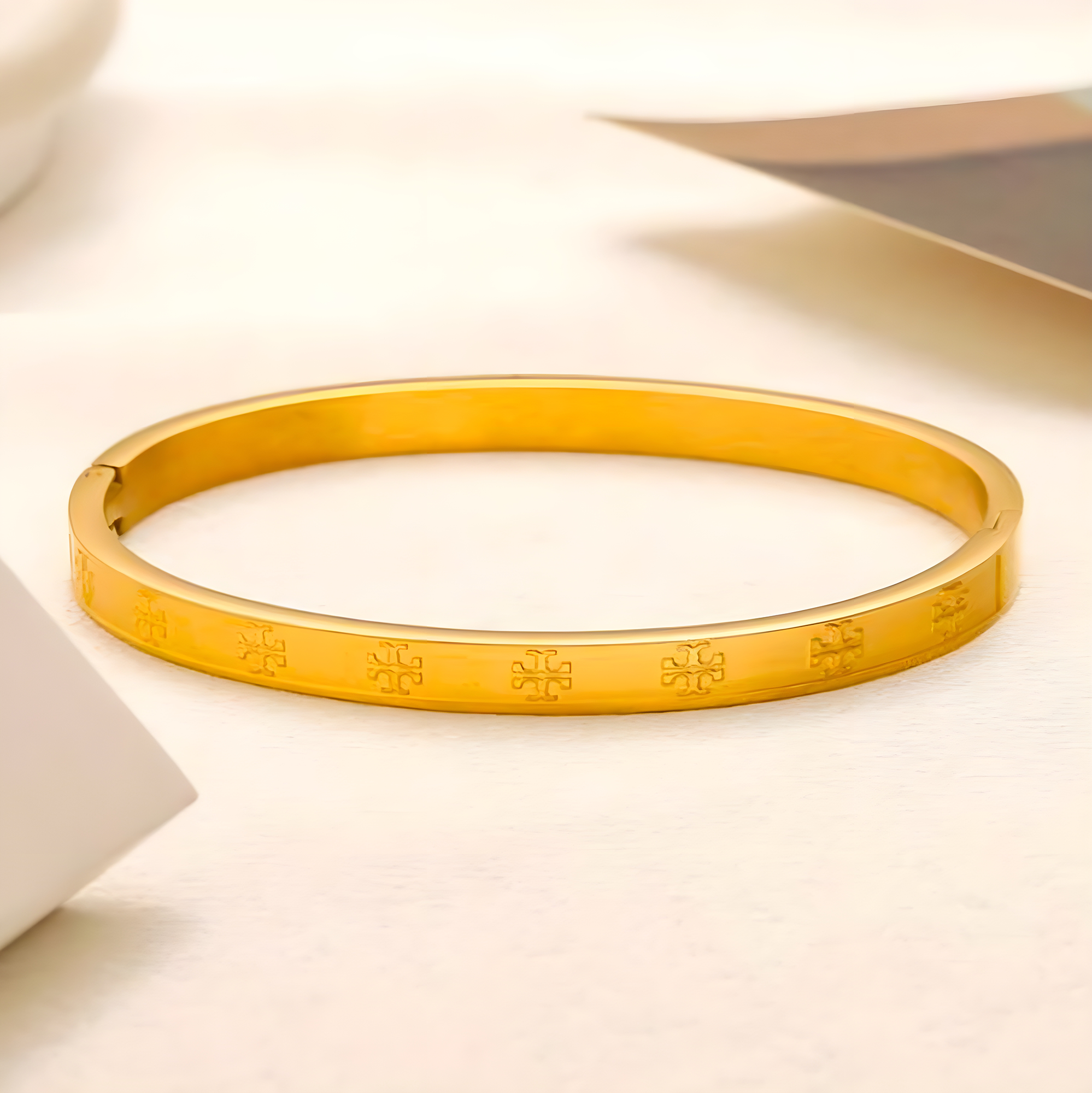 Tory Burch Gold Embossed Emblem Bangle (Stainless Steel)