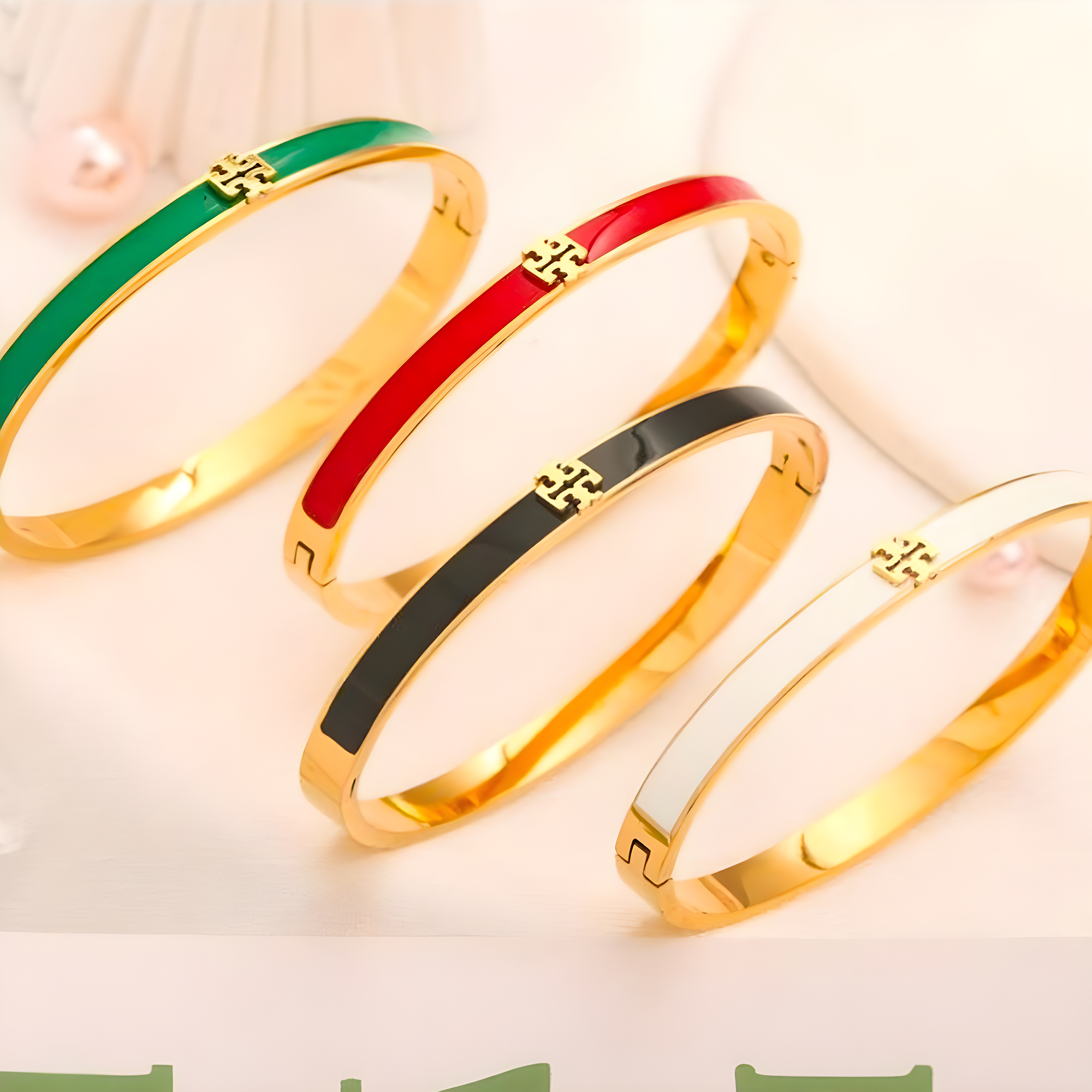 Tory Burch Gold Solitaire Emblem Bangle (Stainless Steel)